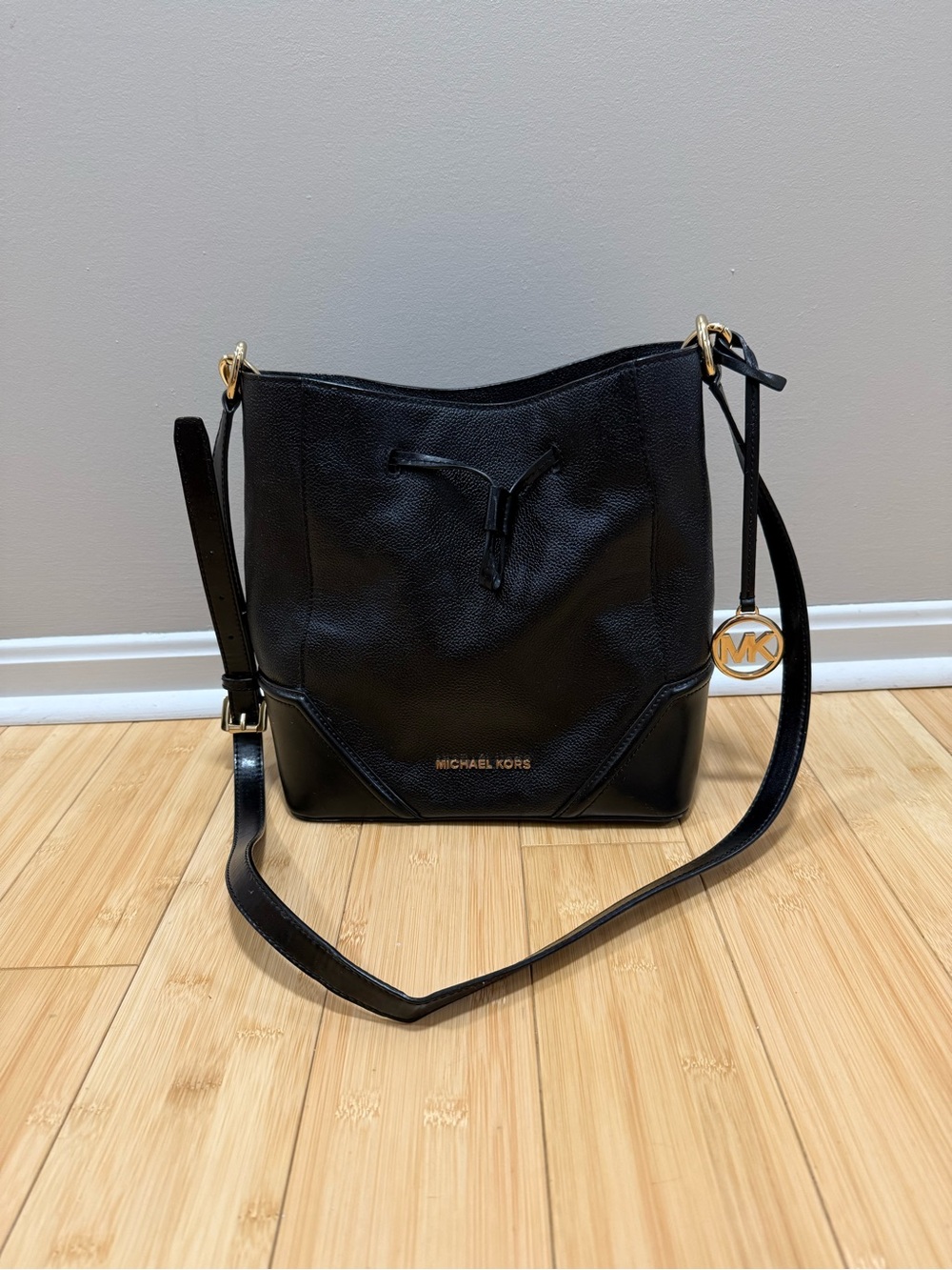 Michael Kors Black Pebble Leather Drawstring Shoulder Bag with Gold MK Charm